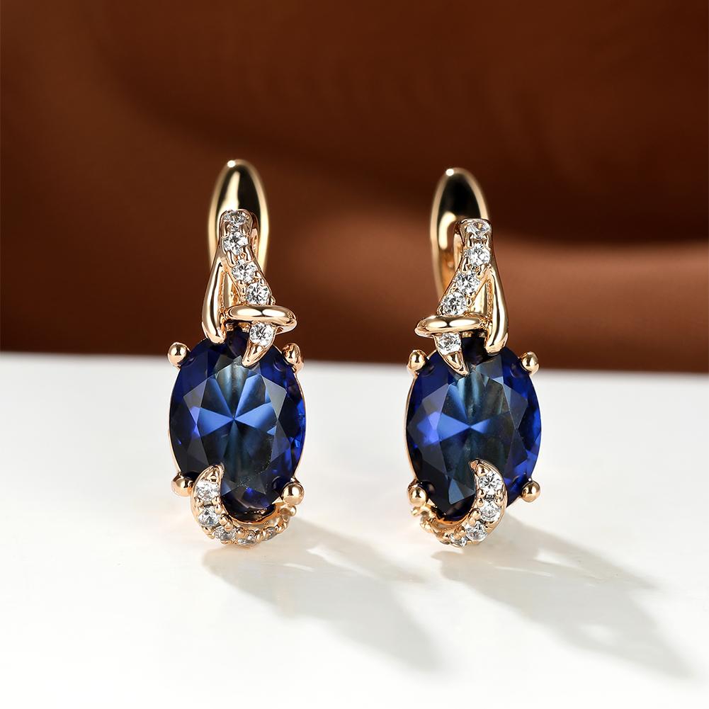Elegant plated blue stone earrings with oval cut design and sparkling accents, perfect for anniversaries and everyday wear.