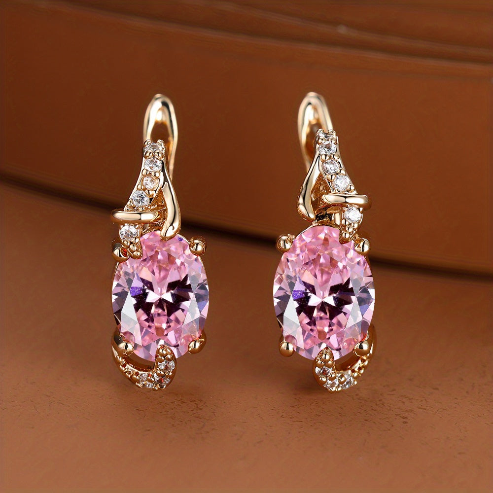Plated pink oval-cut stone drop earrings with sparkling accents, perfect for elegant occasions.